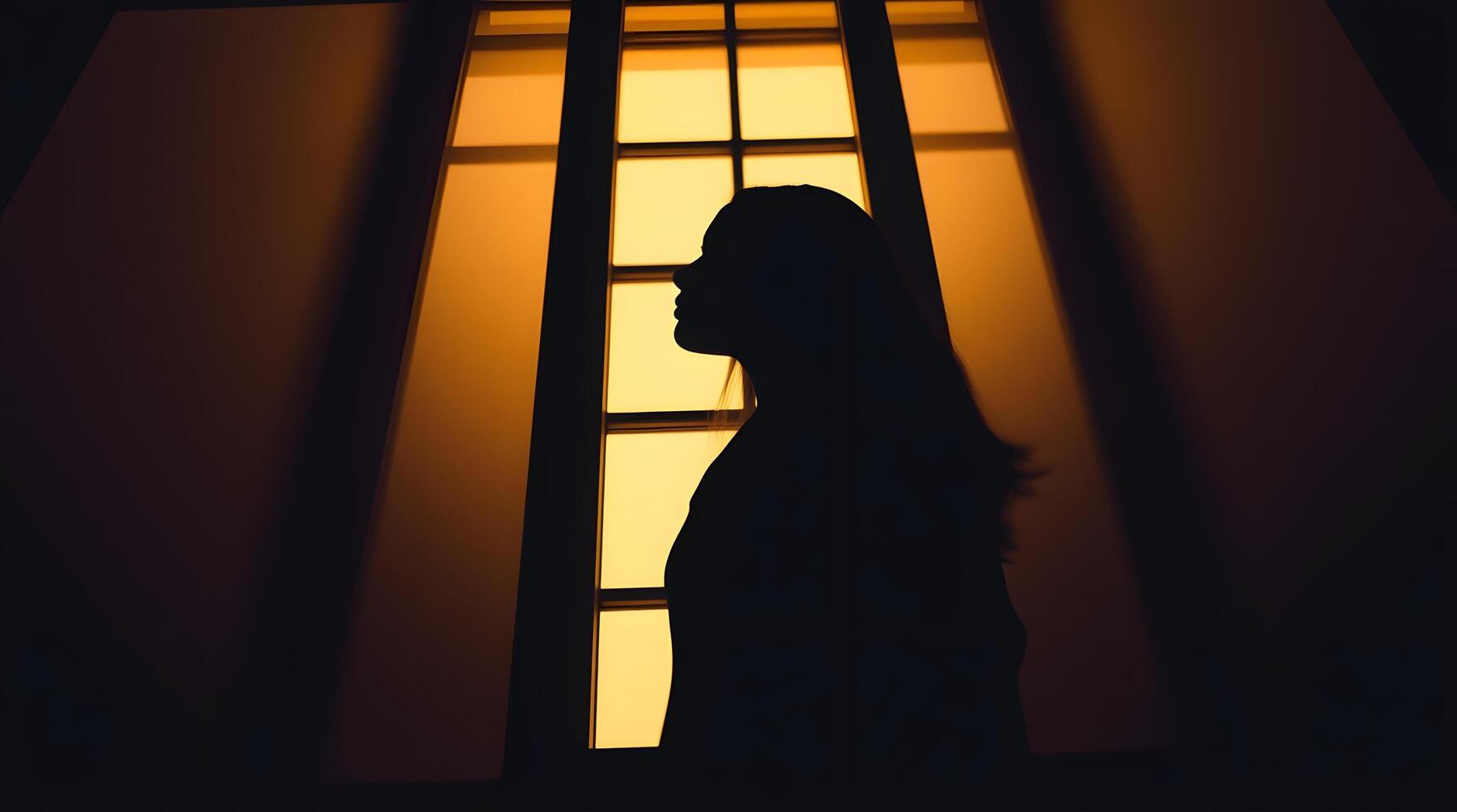 Woman Silhouette in Window Light Creates Introspective Mood for Reflection photo