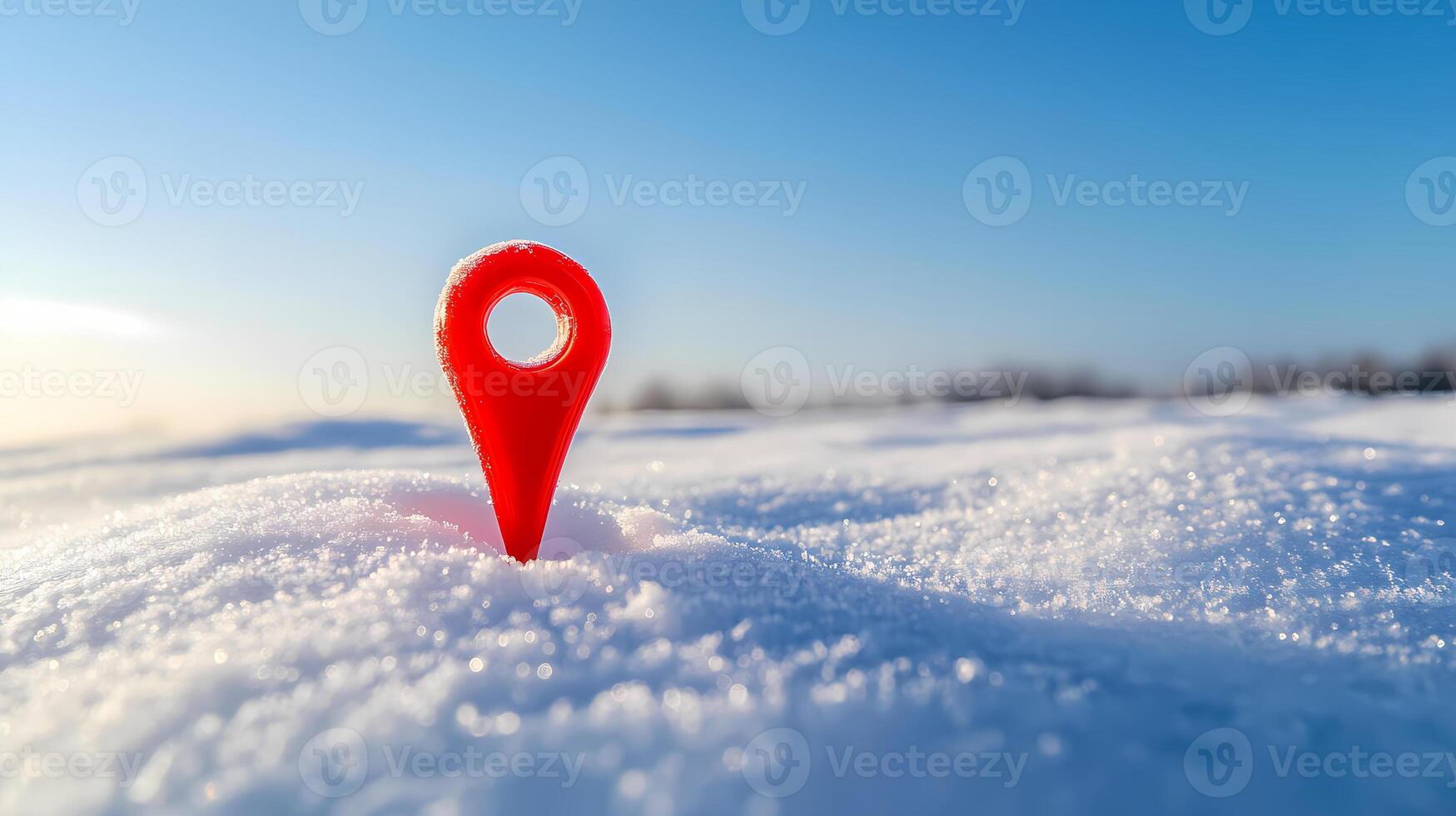 Red location pin marking spot on snowy ground in winter photo
