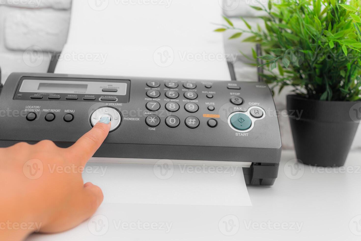 Fax machine, office equipment on white table photo