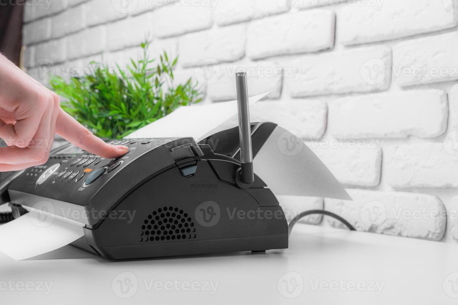 Fax machine close up in an office photo
