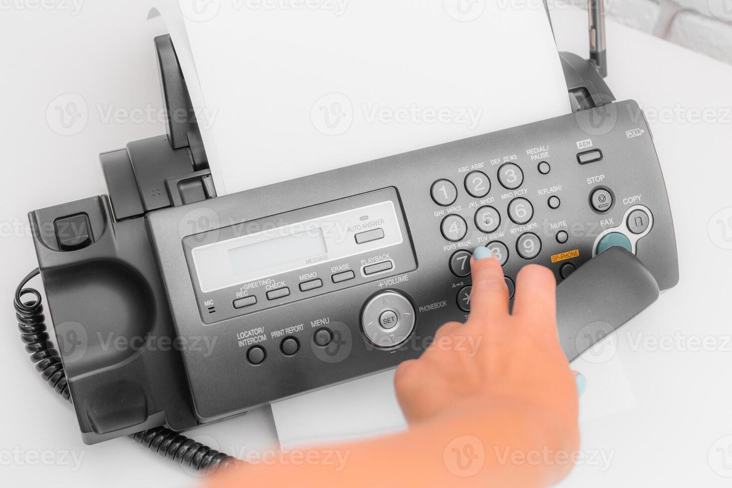 Fax machine, office equipment on white table photo