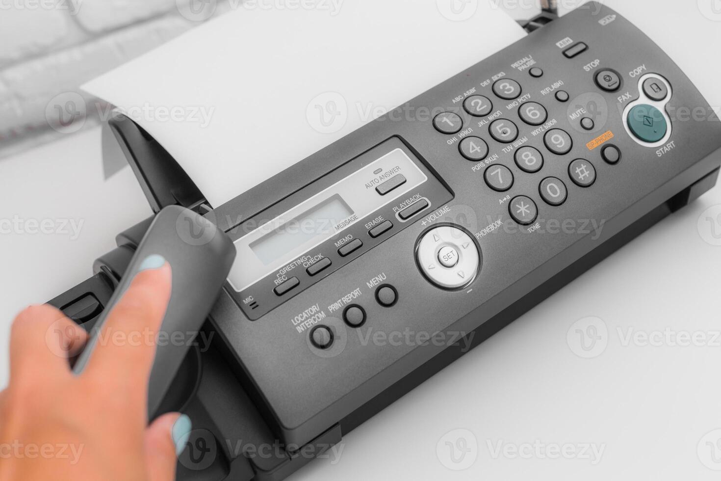 Fax machine, office equipment on white table photo