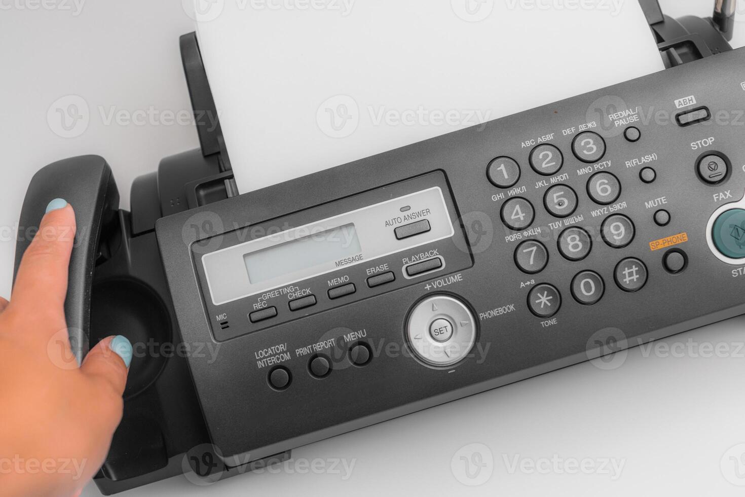 Fax machine, office equipment on white table photo