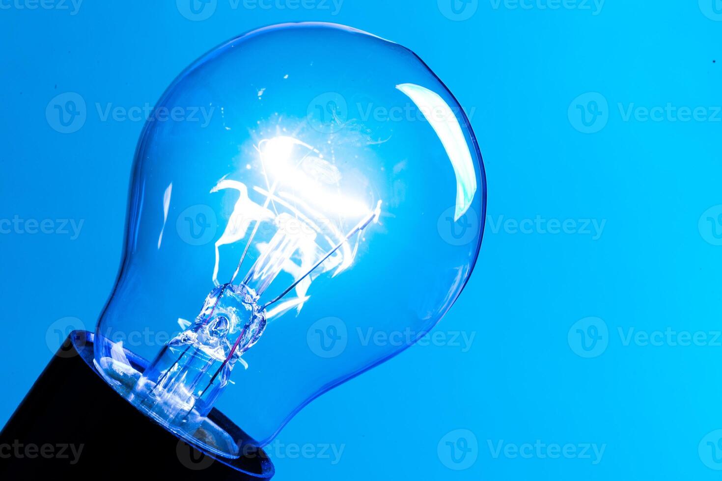 Close up of an illuminated light bulb photo
