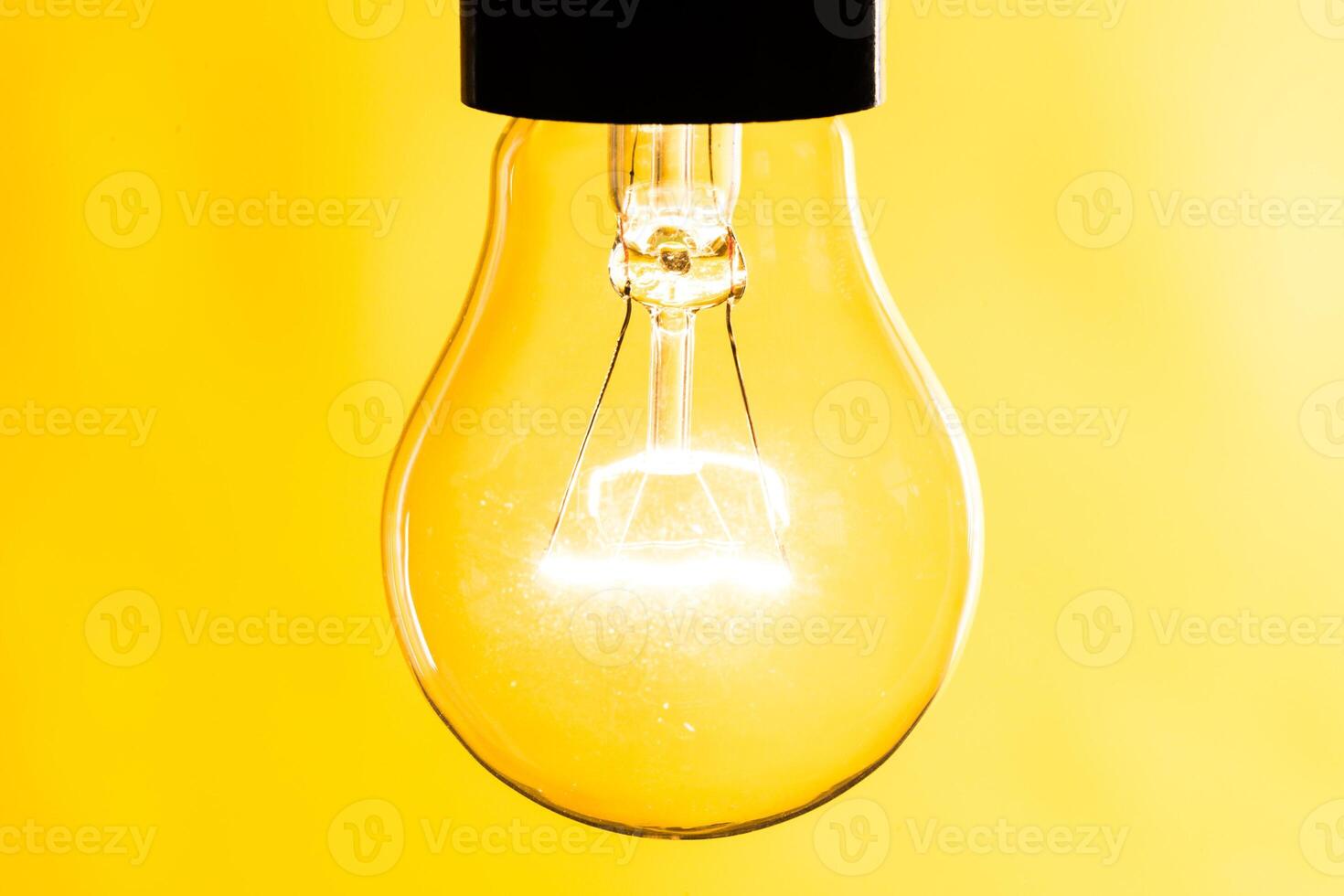 Close up of an illuminated light bulb photo