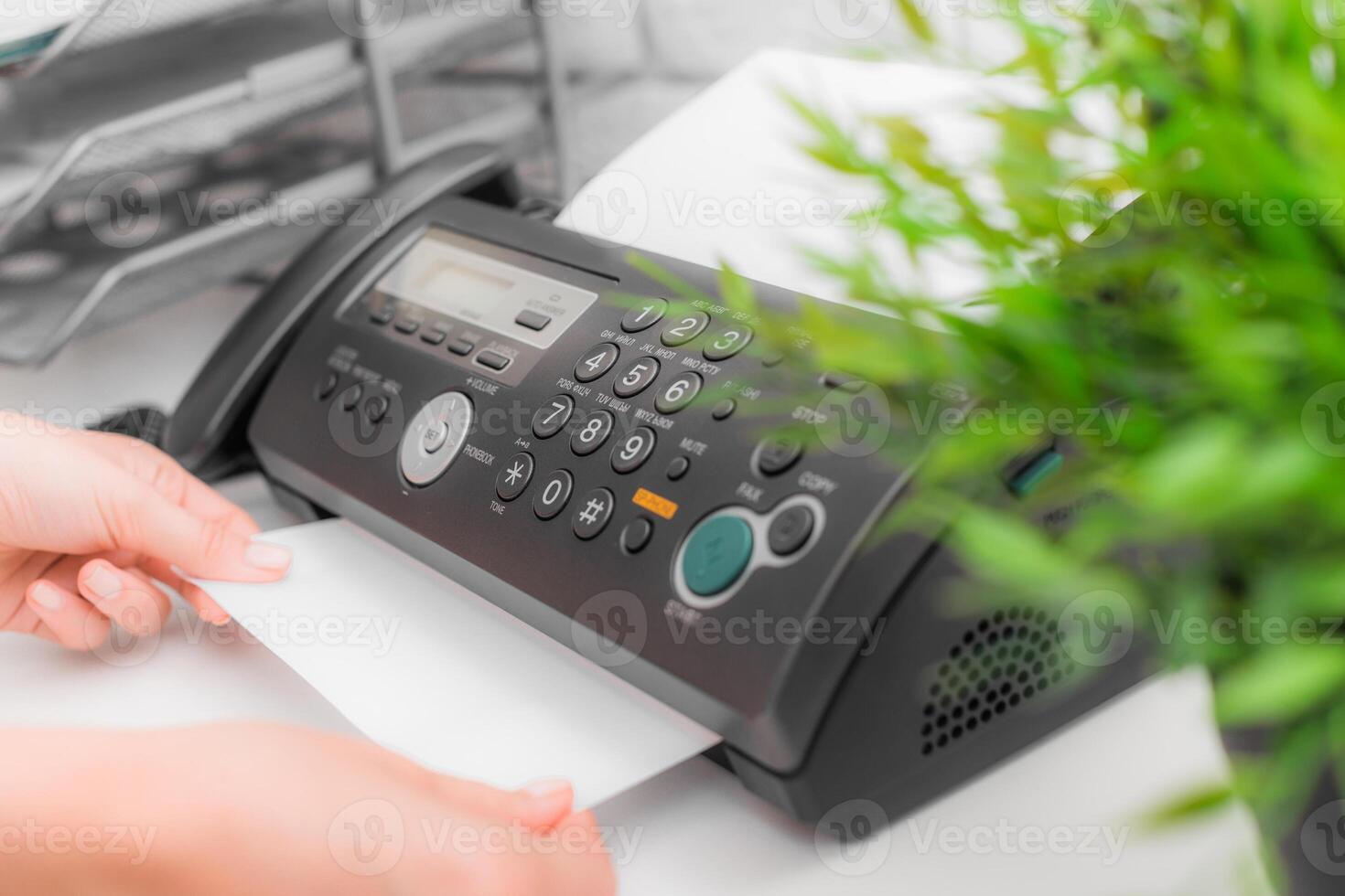 Fax machine close up in an office photo