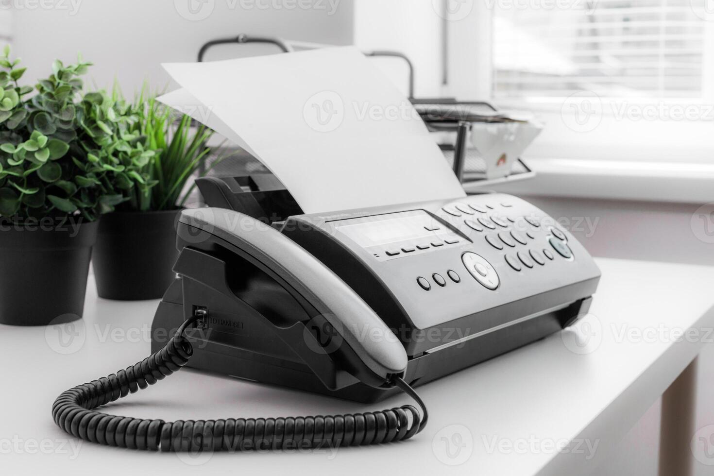 Black fax machine tool close up, business concept photo