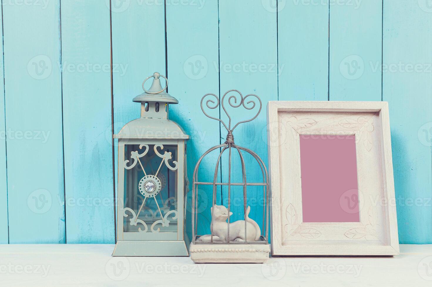 Home decor items on blue wooden background photo