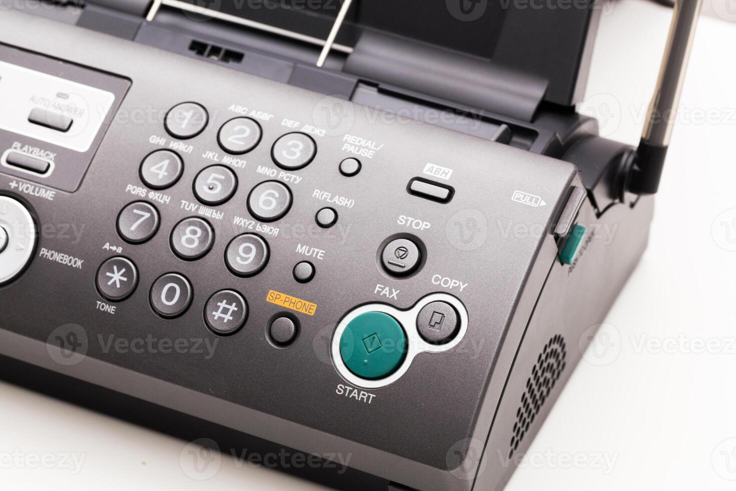 Close up of a fax machine in an office photo