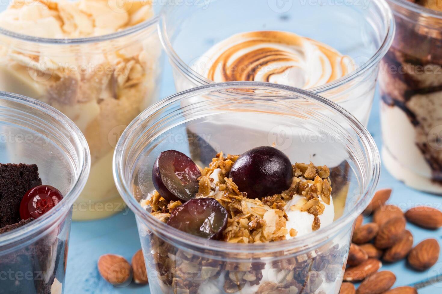 Close up of several desserts in cups photo