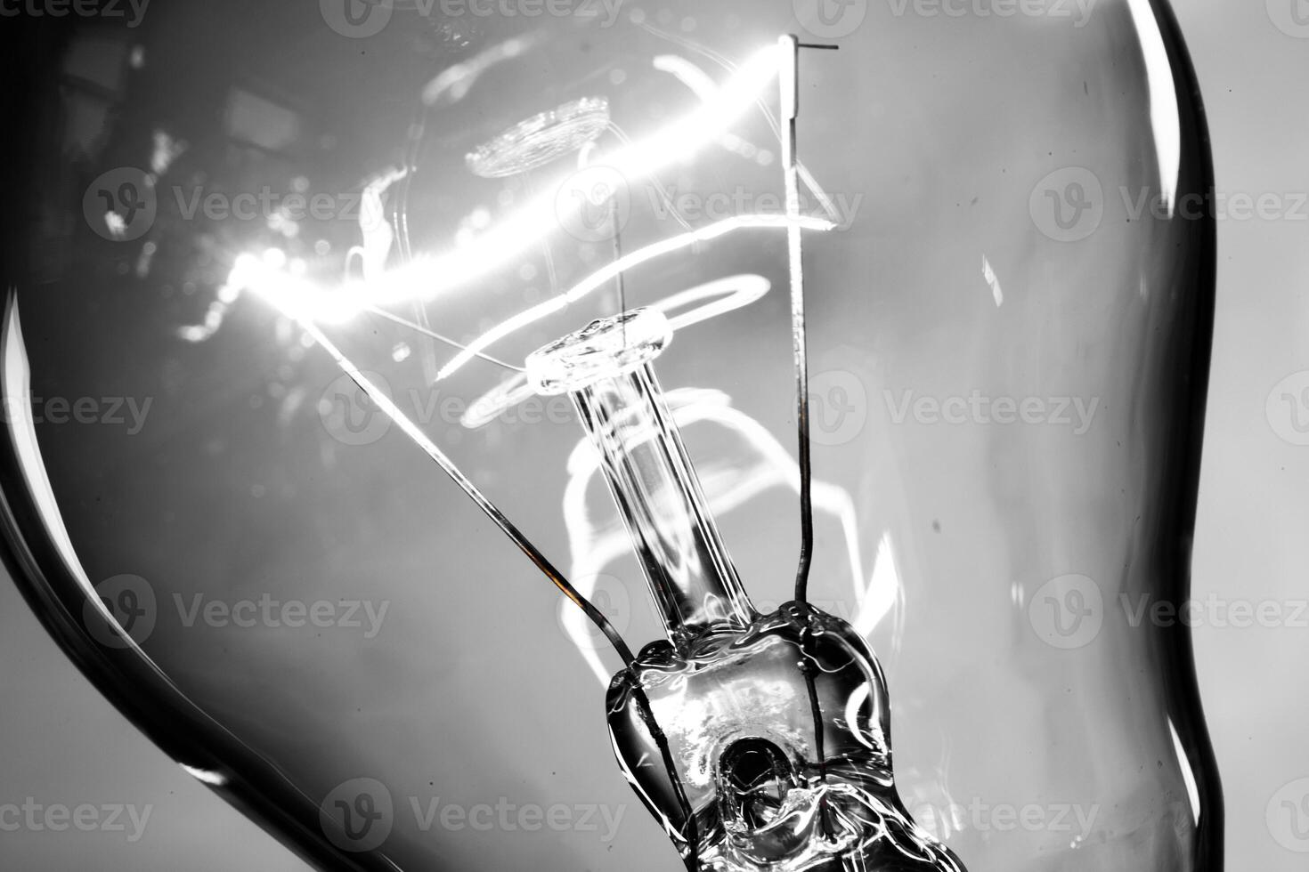 Close up of an illuminated light bulb photo