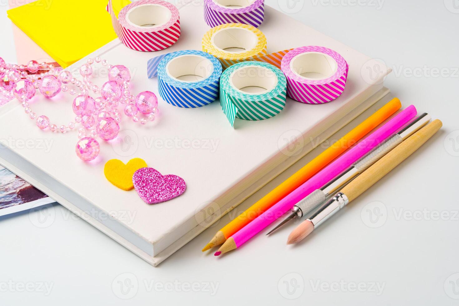 Colorful crafting supplies arranged on a workspace showcasing creativity and vibrant colors photo