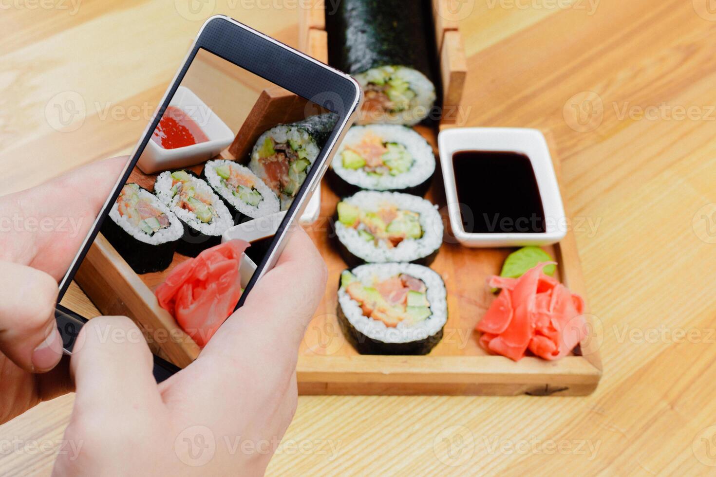 Close up photo of sushi roll served in a plate in a restaurant