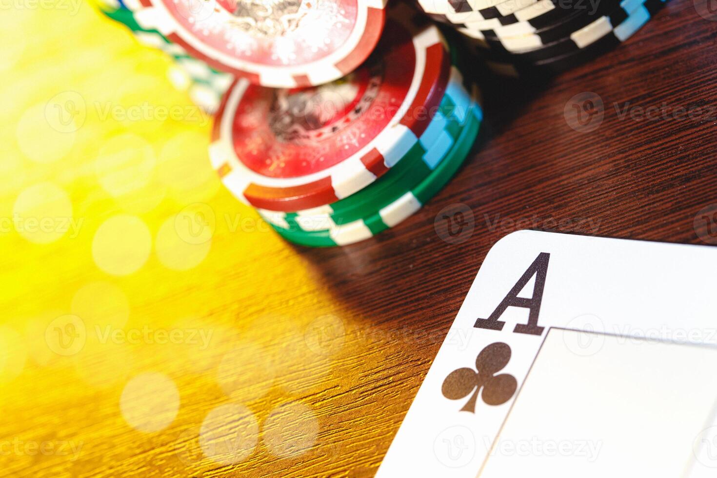 Poker cards and chips on blurred background photo