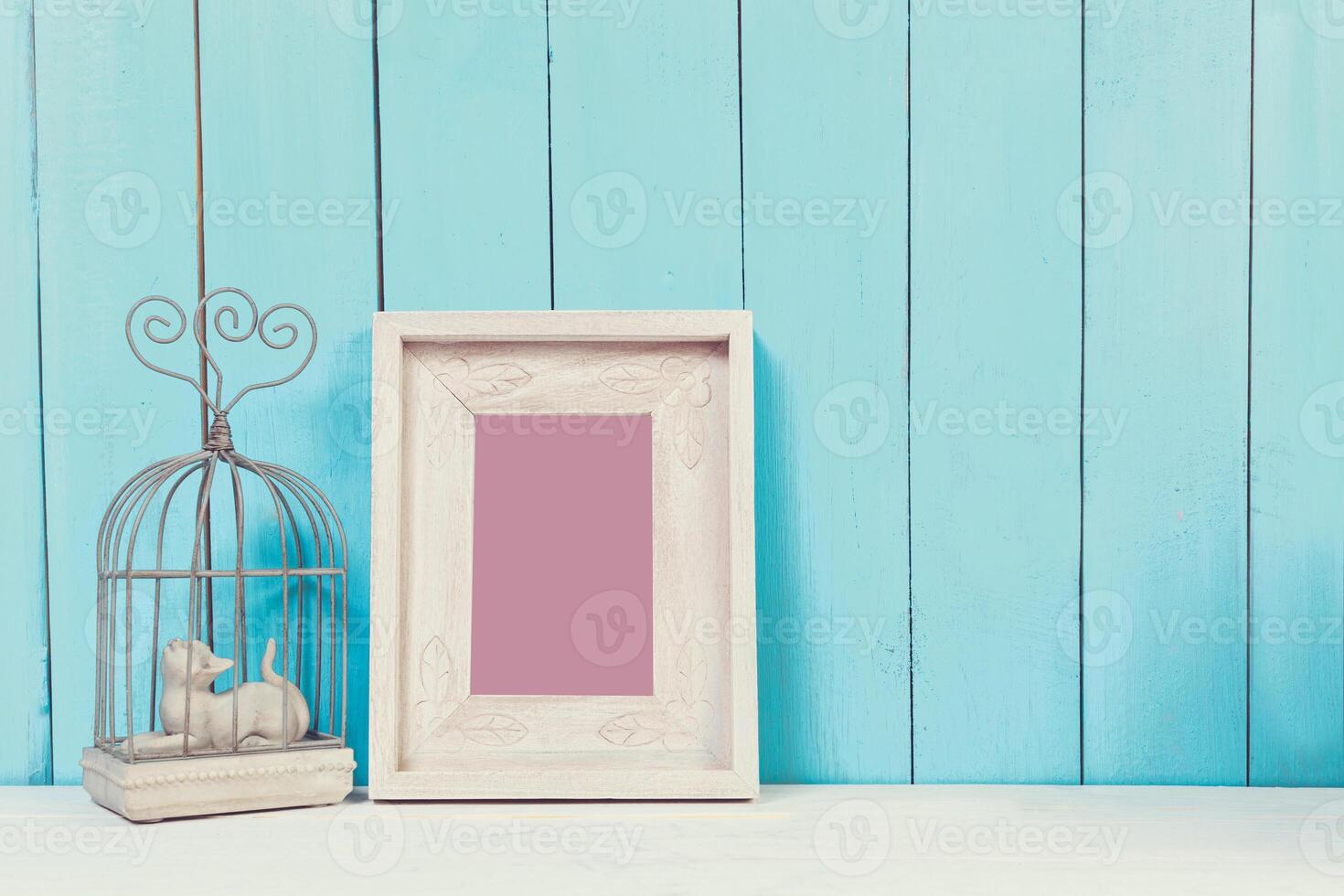 Home decor items on blue wooden background photo