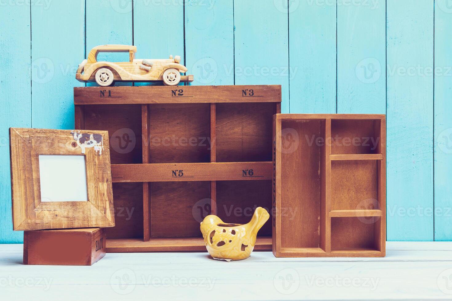 Cozy pastel wooden home decor objects on blue background photo