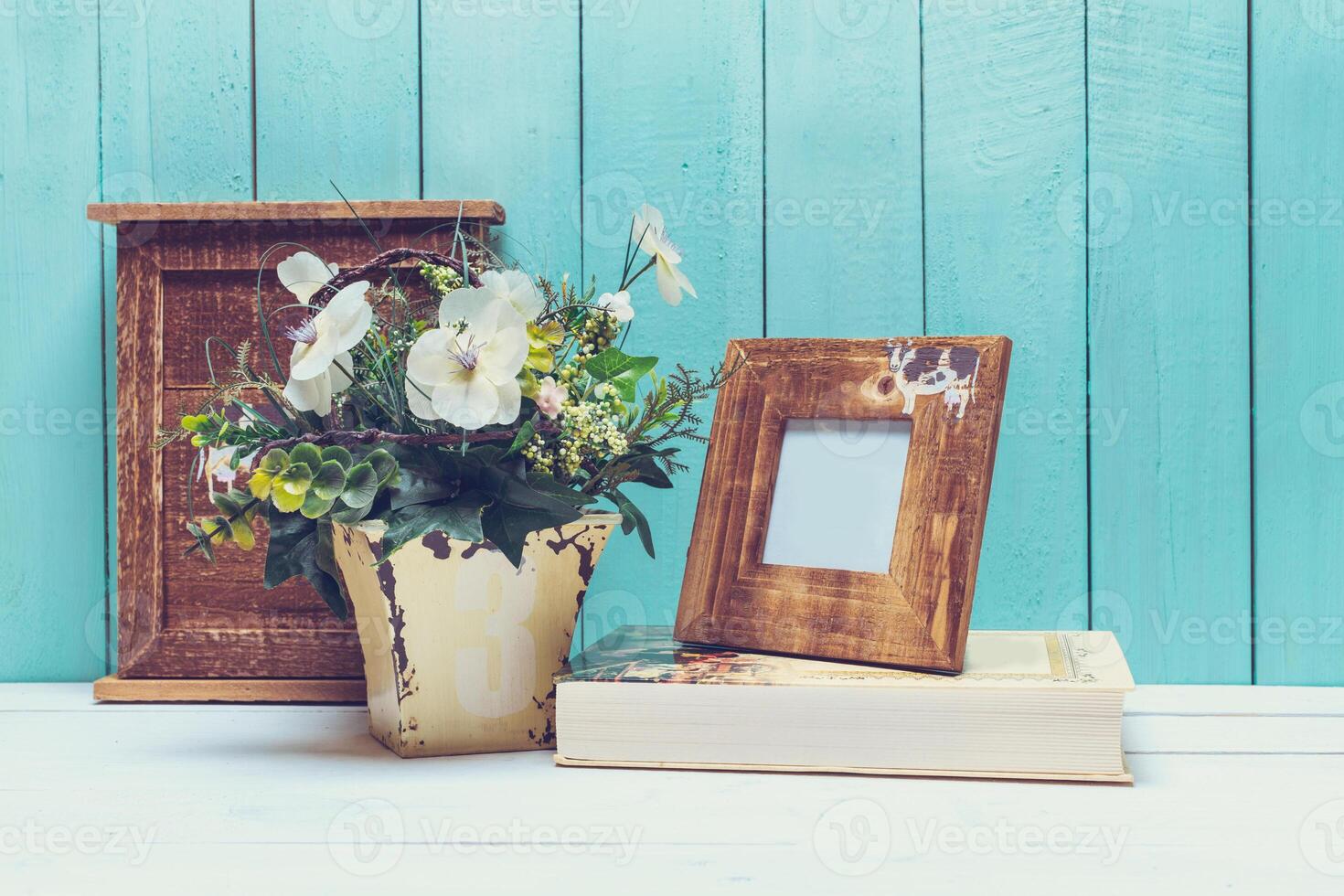 Shabby chic style home decorations on wooden background photo
