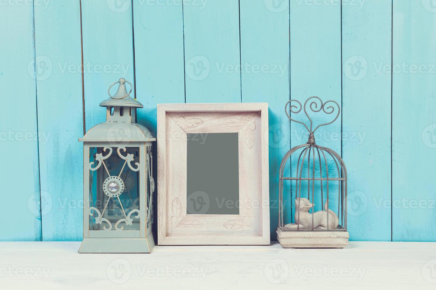 Home decor items on blue wooden background photo