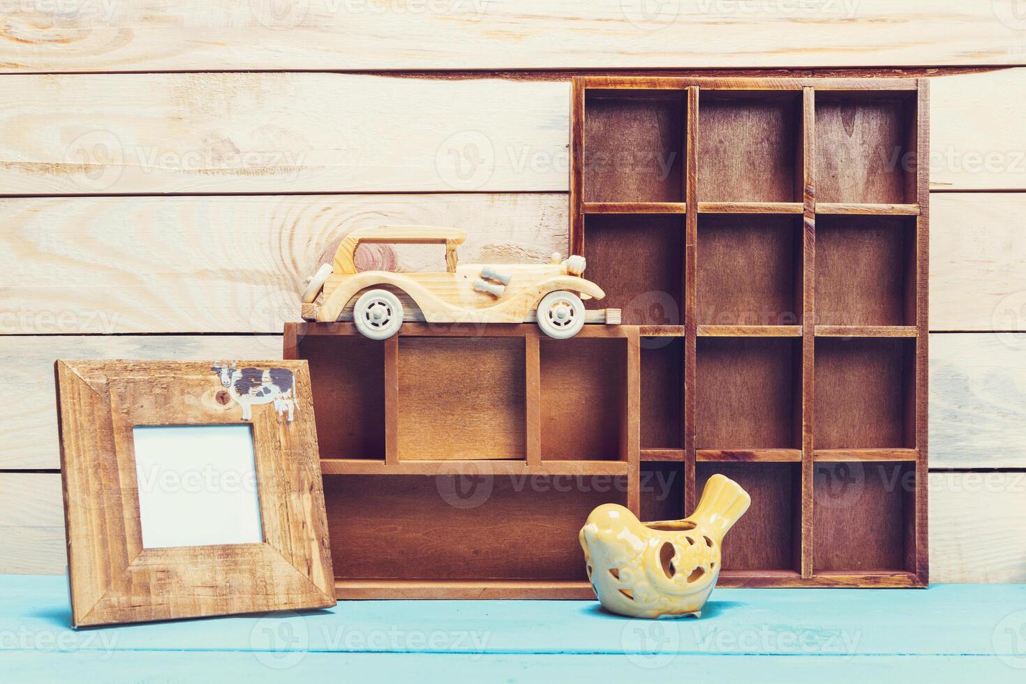 Cozy pastel wooden home decor objects on blue background photo