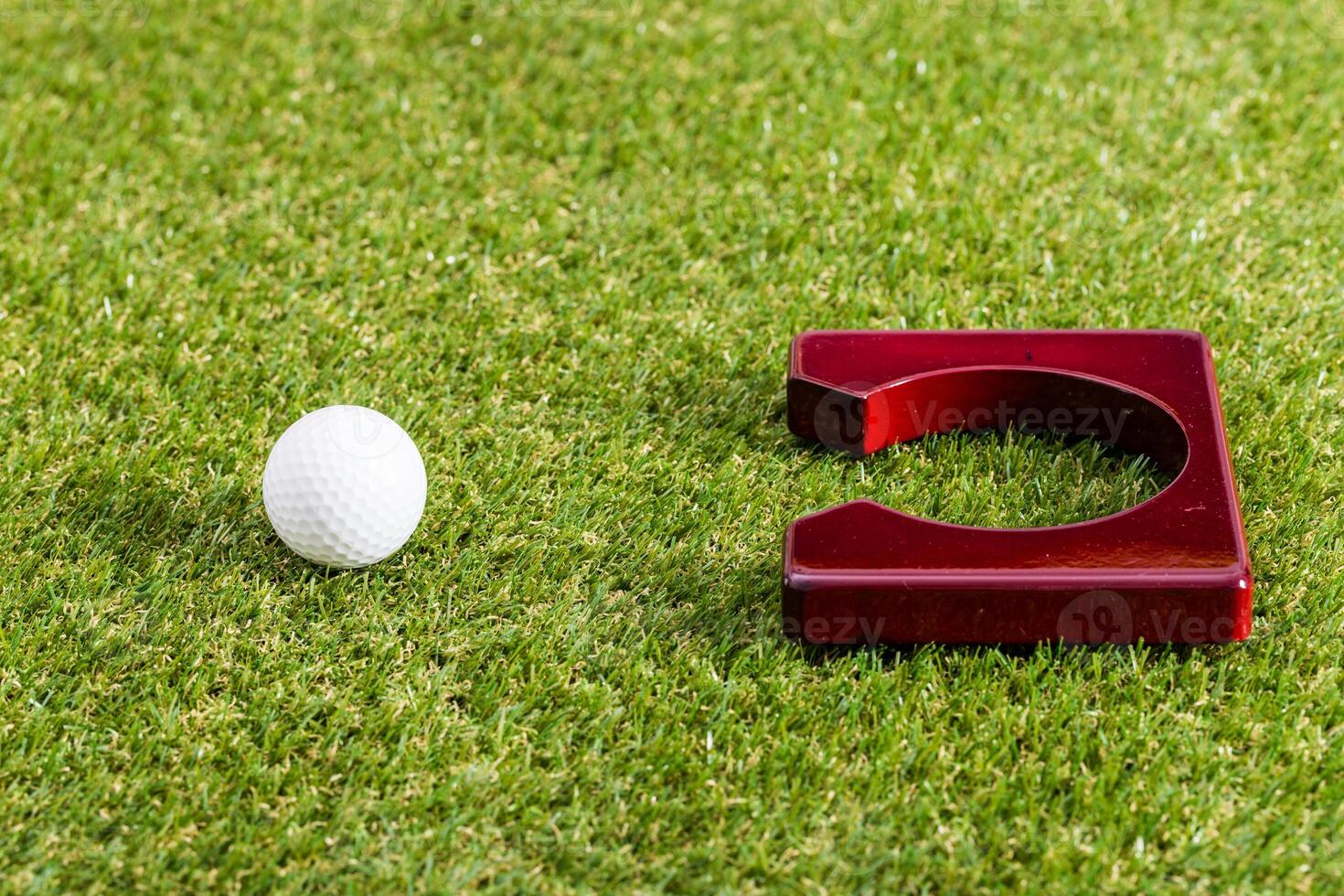 Mini golf. Golf equipment on grass close up photo