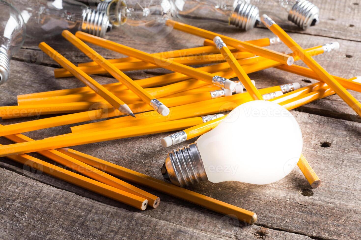Lightbulb and blank open notepad. Having an idea concept photo
