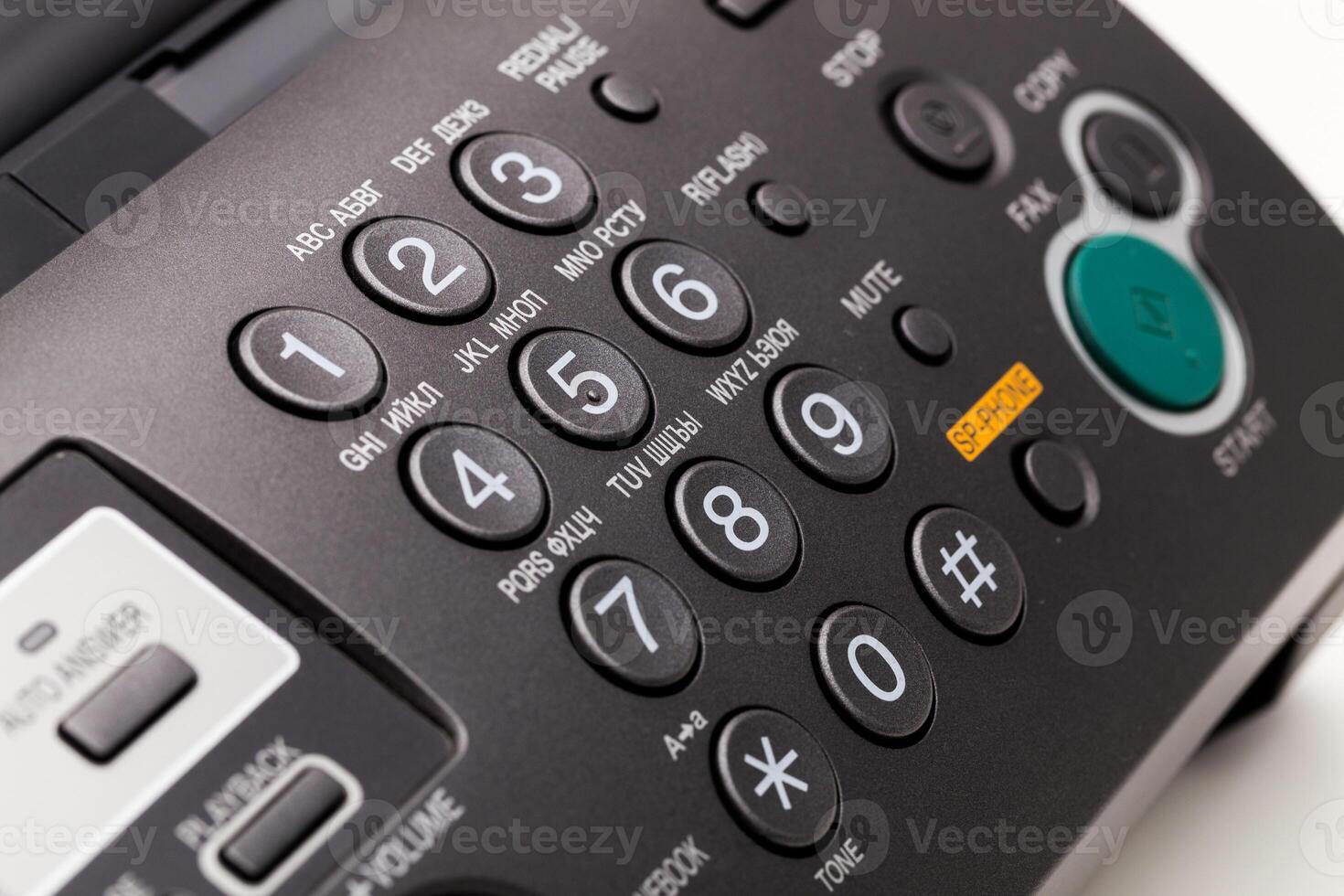 Close up of a fax machine in an office photo