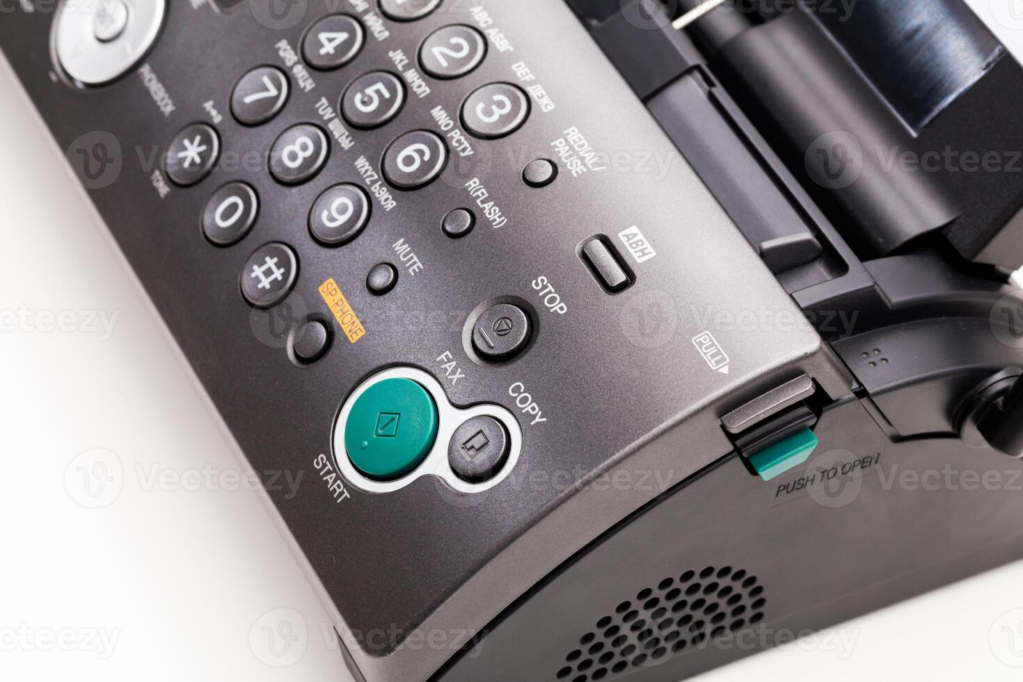 Close up of a fax machine in an office photo
