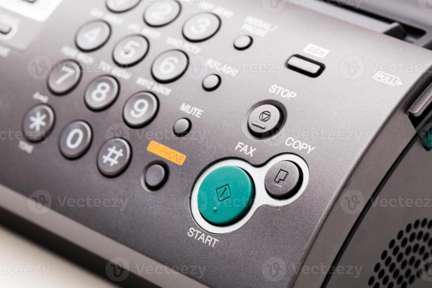 Close up of a fax machine in an office photo