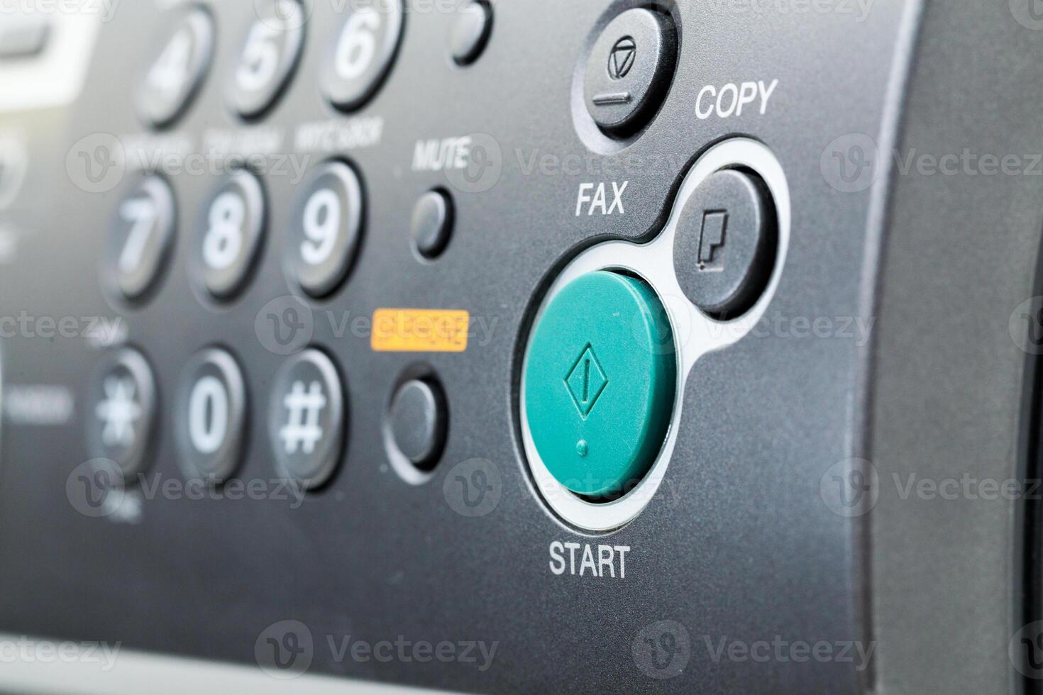 Close up of a fax machine in an office photo