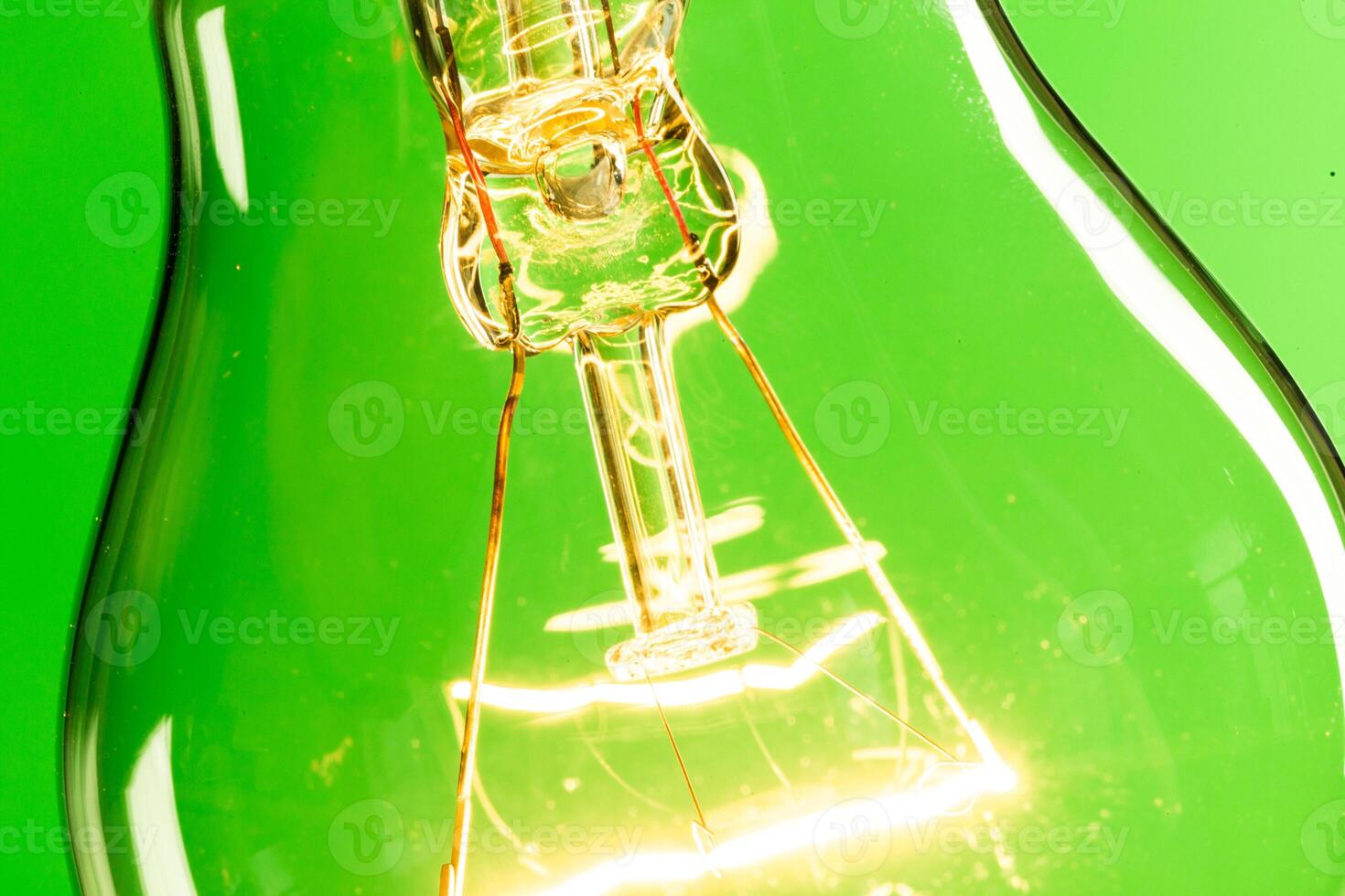 Close up of an illuminated light bulb photo