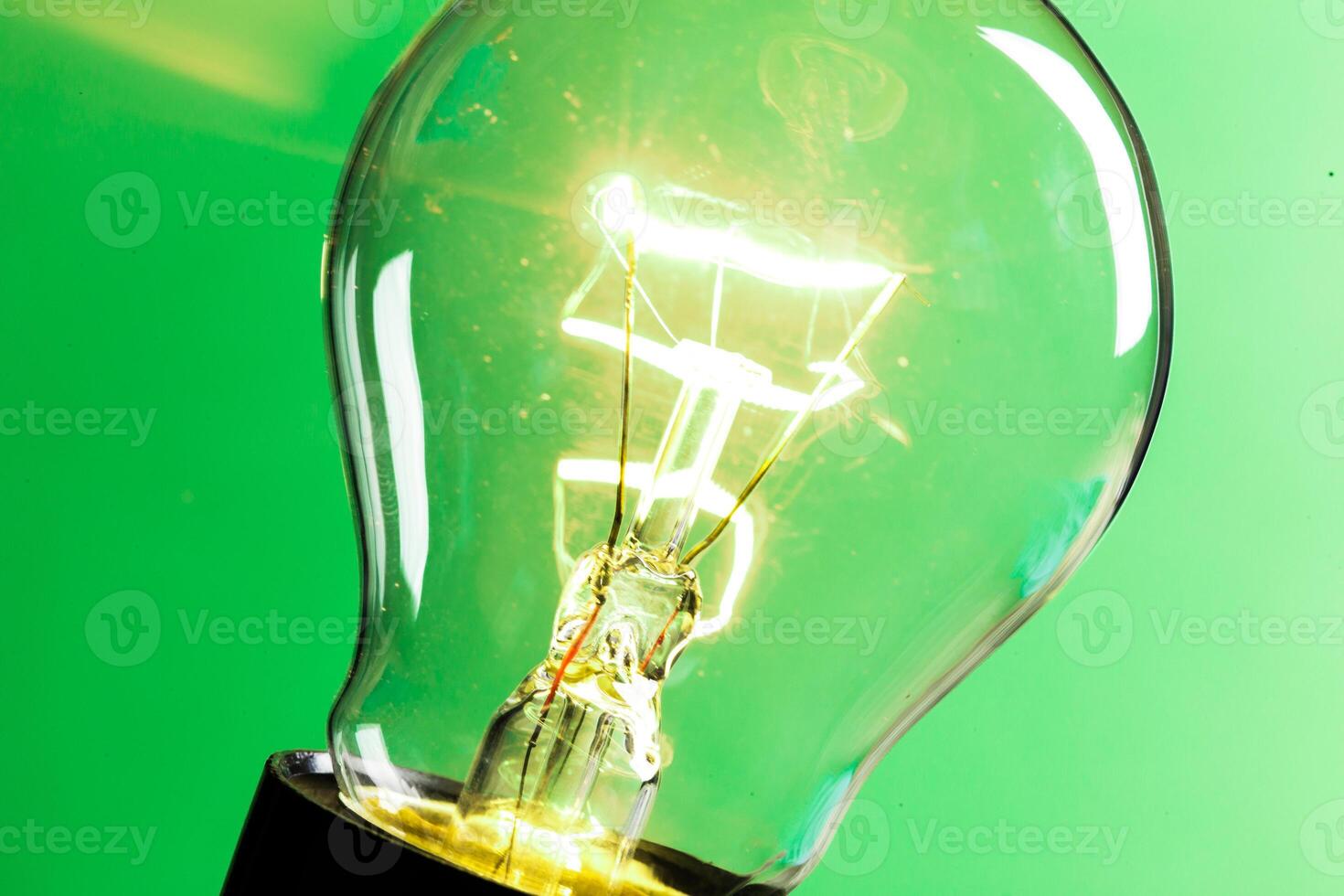 Close up of an illuminated light bulb photo