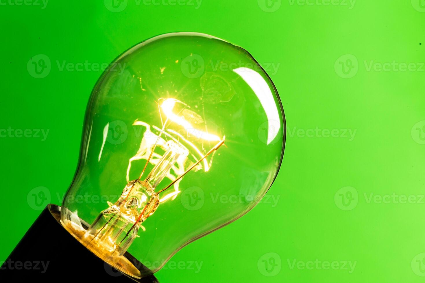 Close up of an illuminated light bulb photo