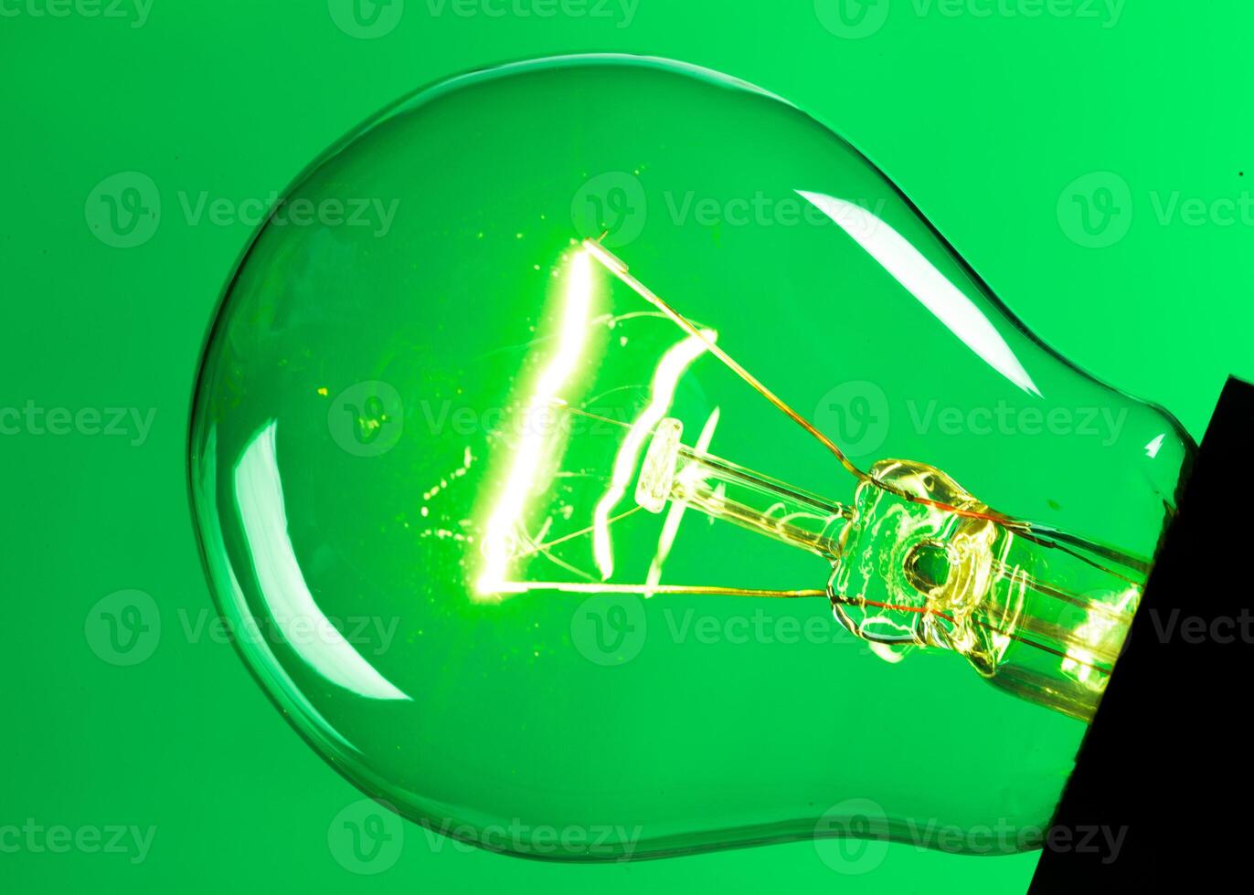 Close up of an illuminated light bulb photo