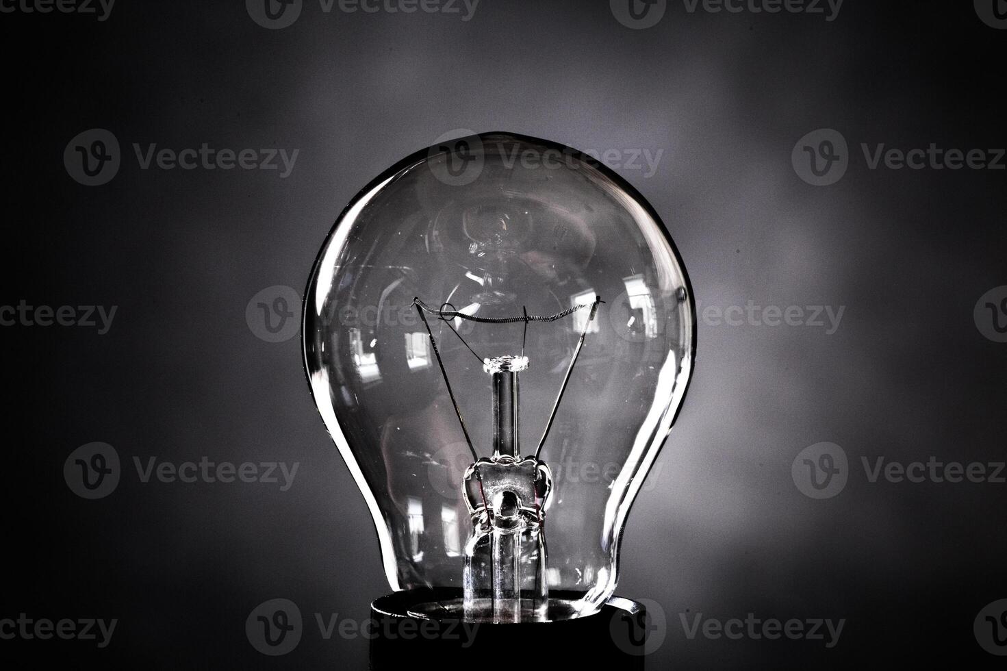 Close-up of electrical bulb on black background photo