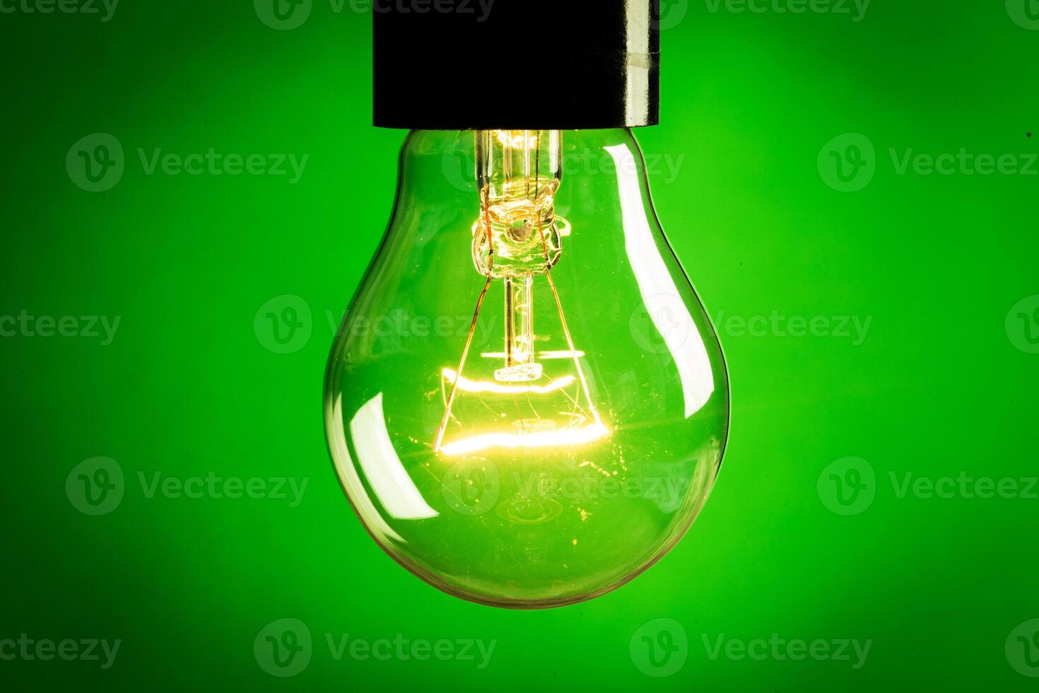 Close up of an illuminated light bulb photo