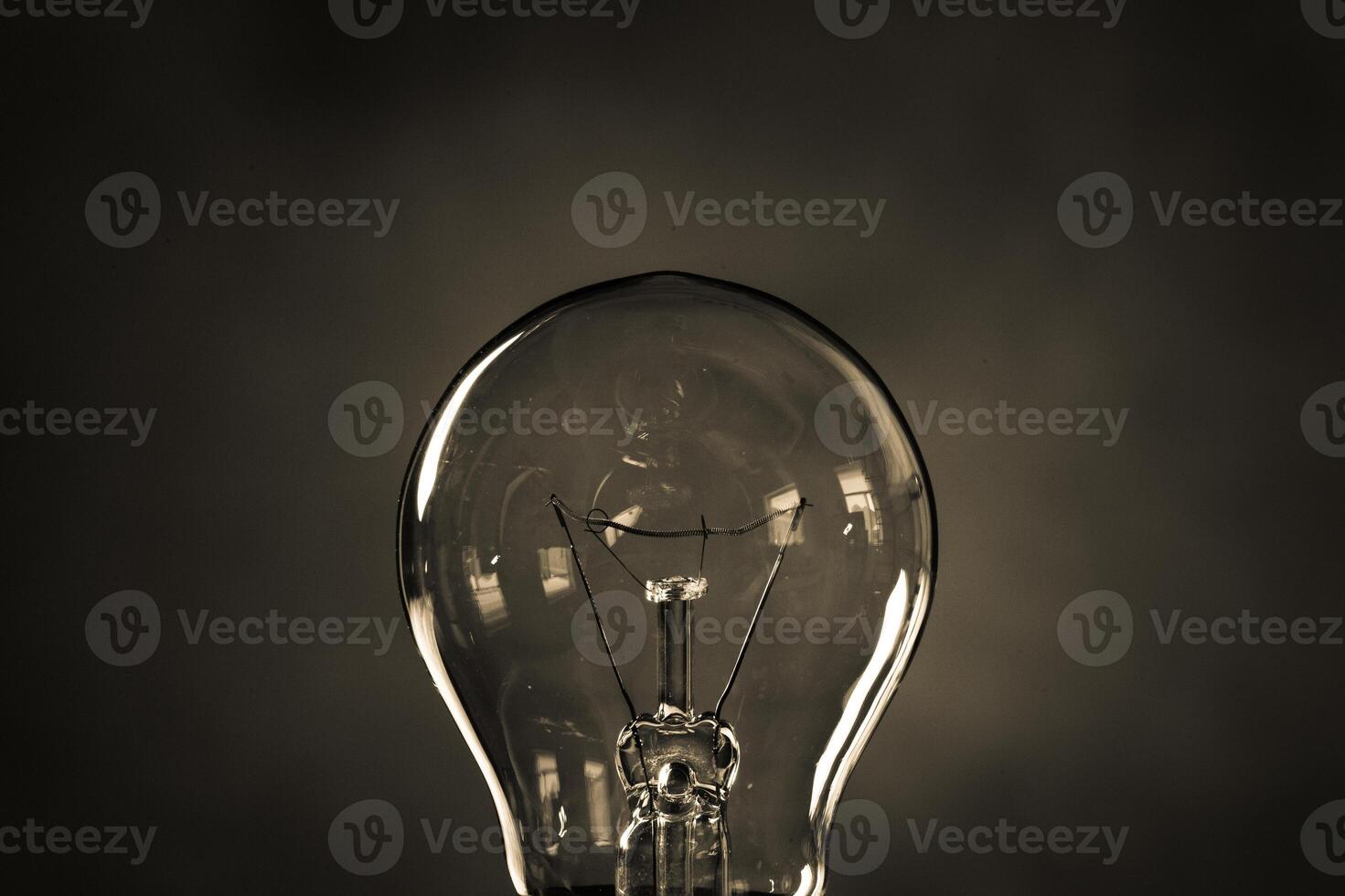 Close-up of electrical bulb on black background photo