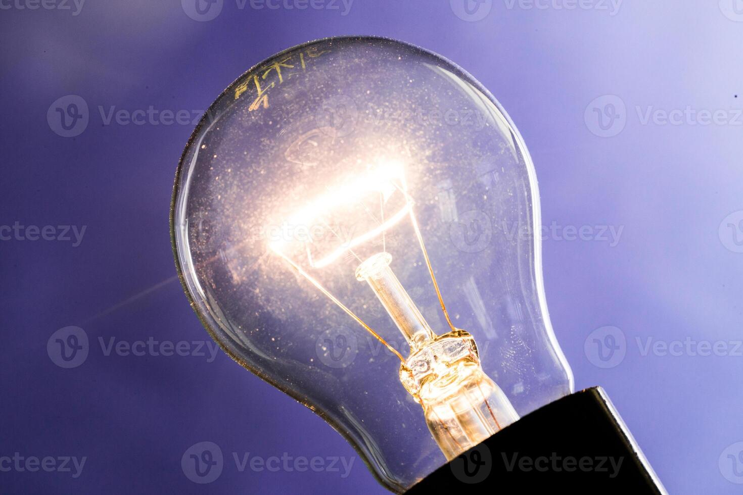 Close up of an illuminated light bulb photo