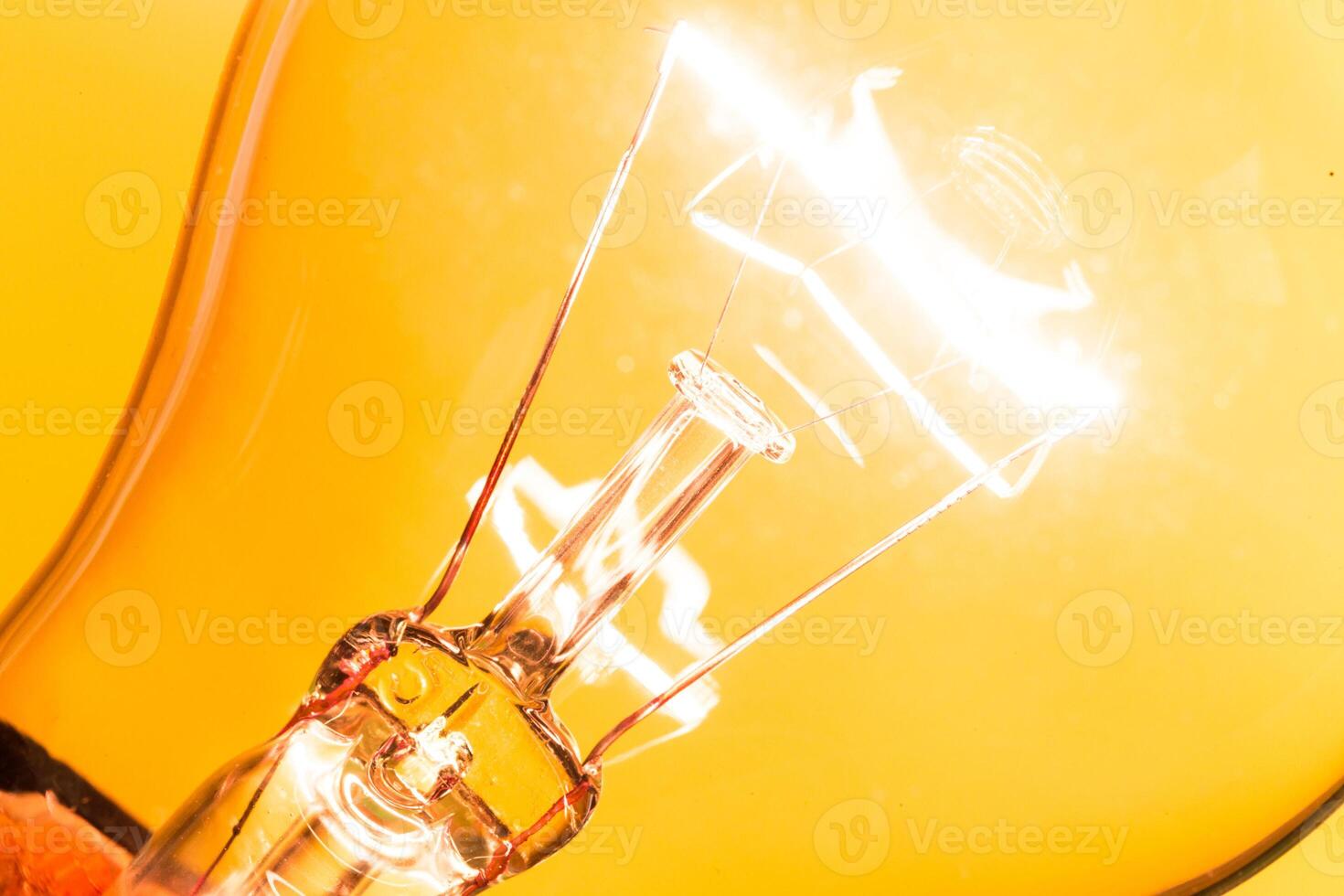Close up of an illuminated light bulb photo