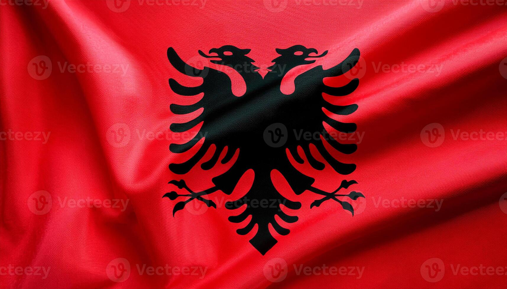 Albania national flag with realistic fabric texture and smooth folds waving in the wind. photo
