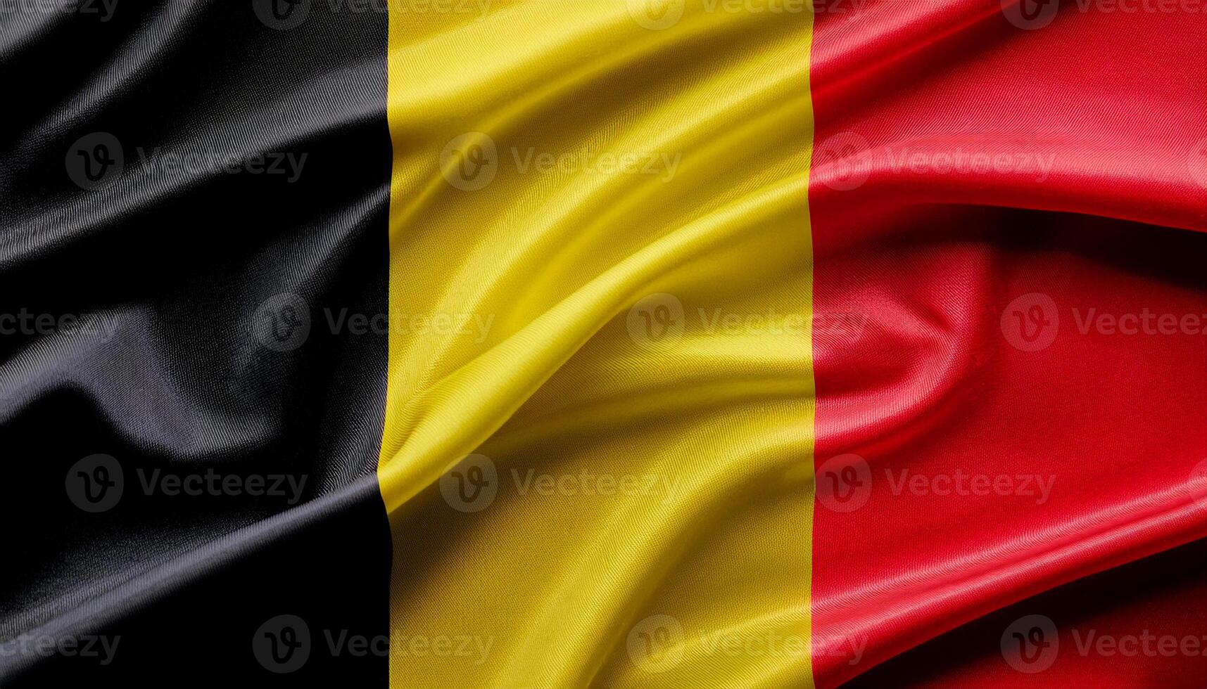 Belgium national flag with realistic fabric texture and smooth folds waving in the wind. photo
