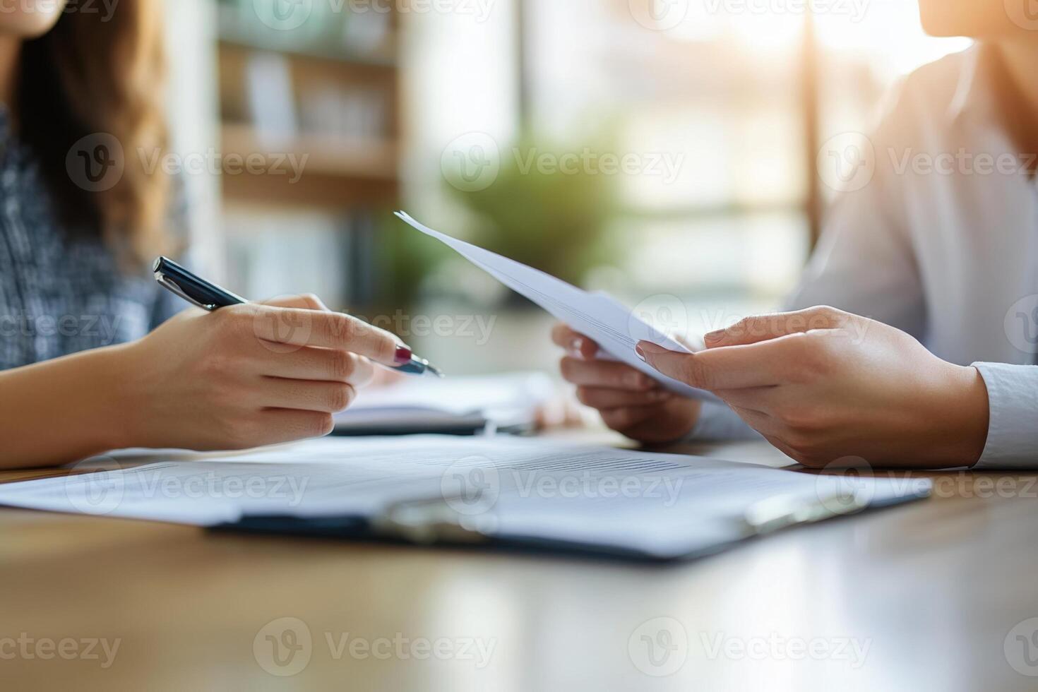 Office work. Paper review. Person holding document. Woman with pen. Sheet on desk. Business concept. Teamwork in progress. photo