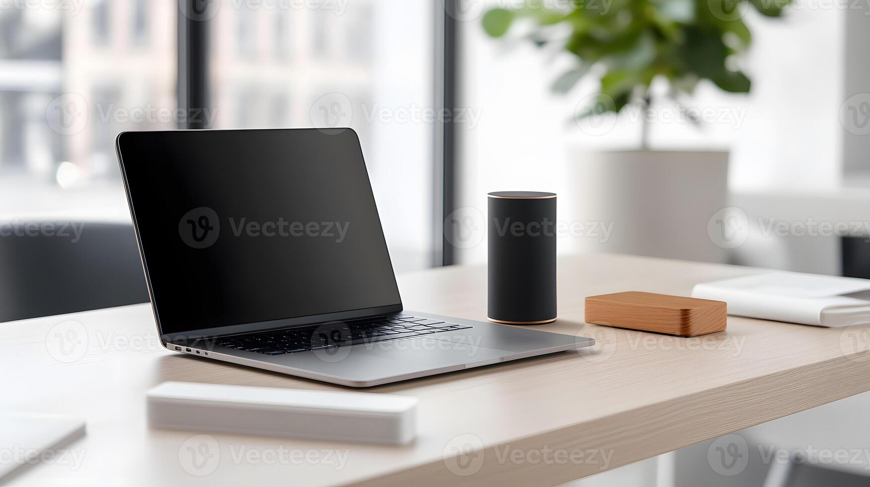 A sleek work desk with a laptop, phone dock, and smart lighting in a well-organized office environment photo