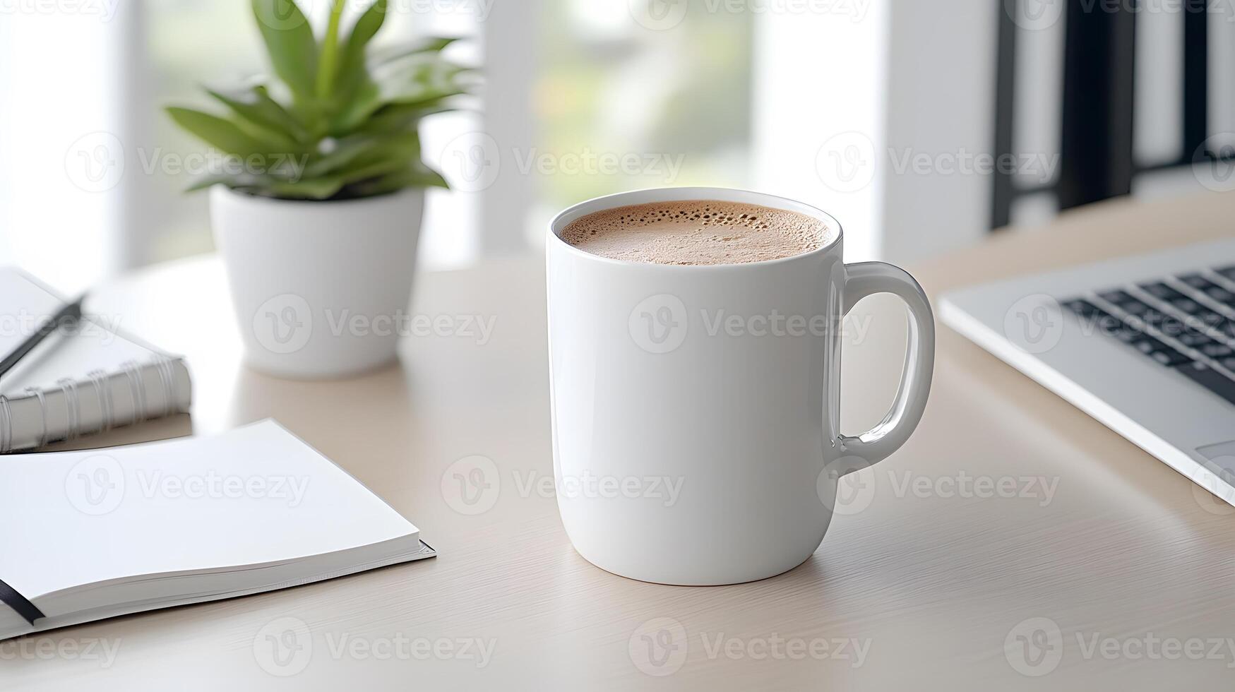 A clean, minimalist workspace with an open notebook and inspiring words written on the first page photo