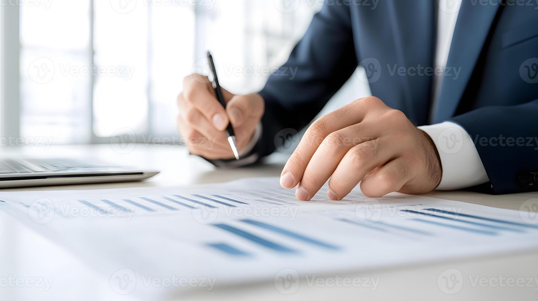 A group of colleagues discussing data trends around a table filled with detailed financial reports and charts photo