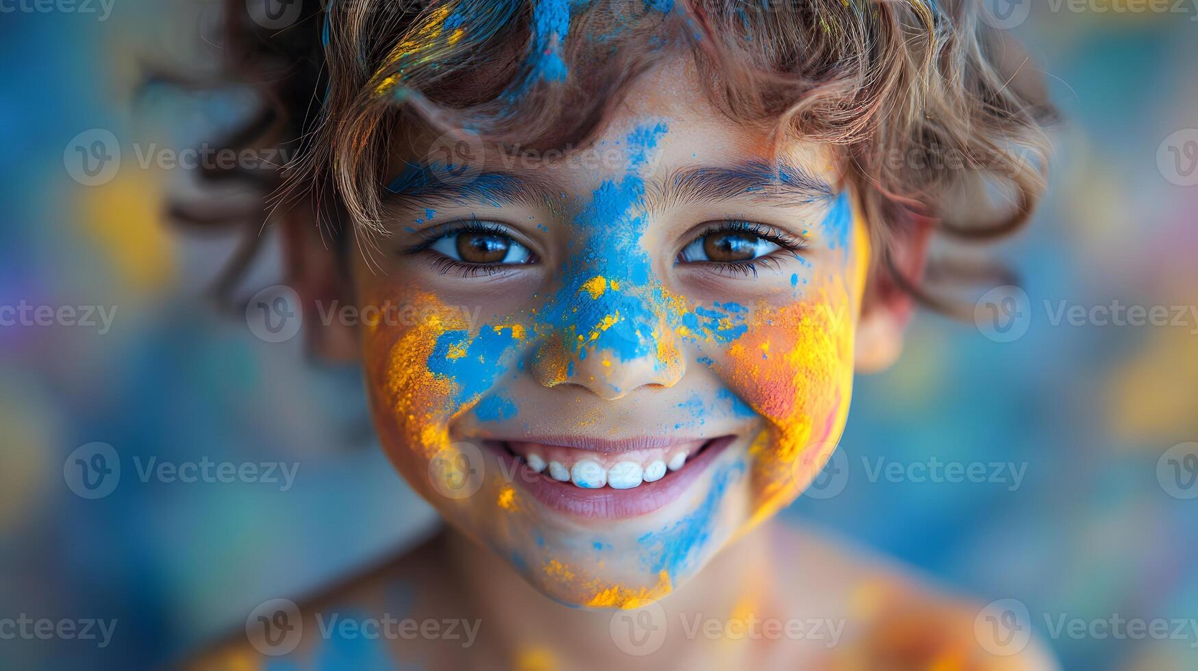 a child face covered in bright Holi colors with a big joyful smile photo