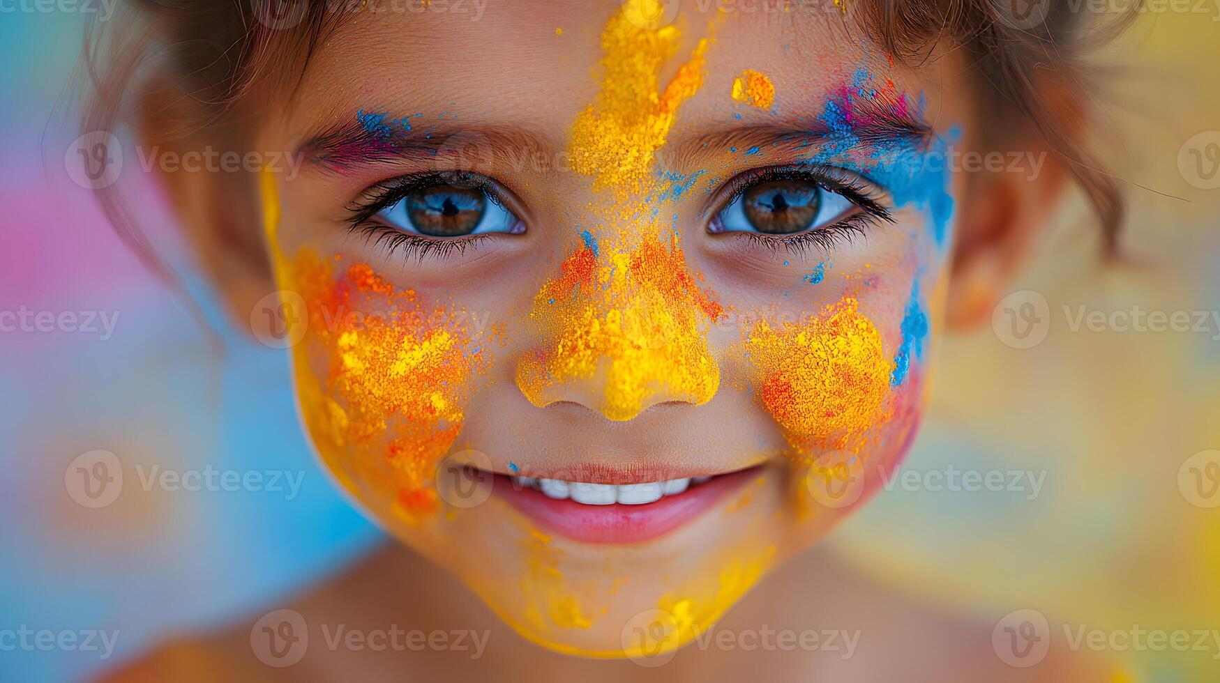 child face covered in bright Holi colors with a big joyful smile photo