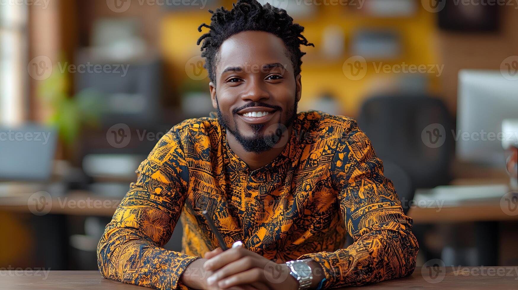 Designer focused on illustration creation using a digital pen on a tablet in a vibrant office photo