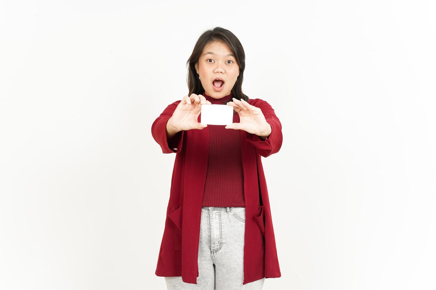 A girl holding a piece of paper up in front of her face photo