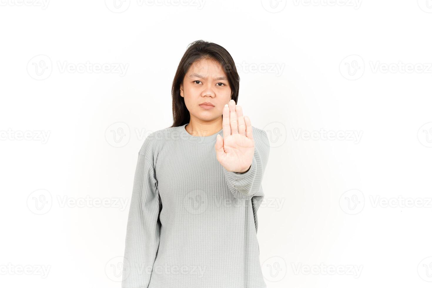 A woman making a stop sign with her hand photo