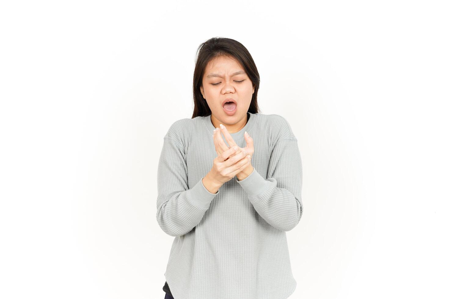 A woman is holding her hands to her mouth photo